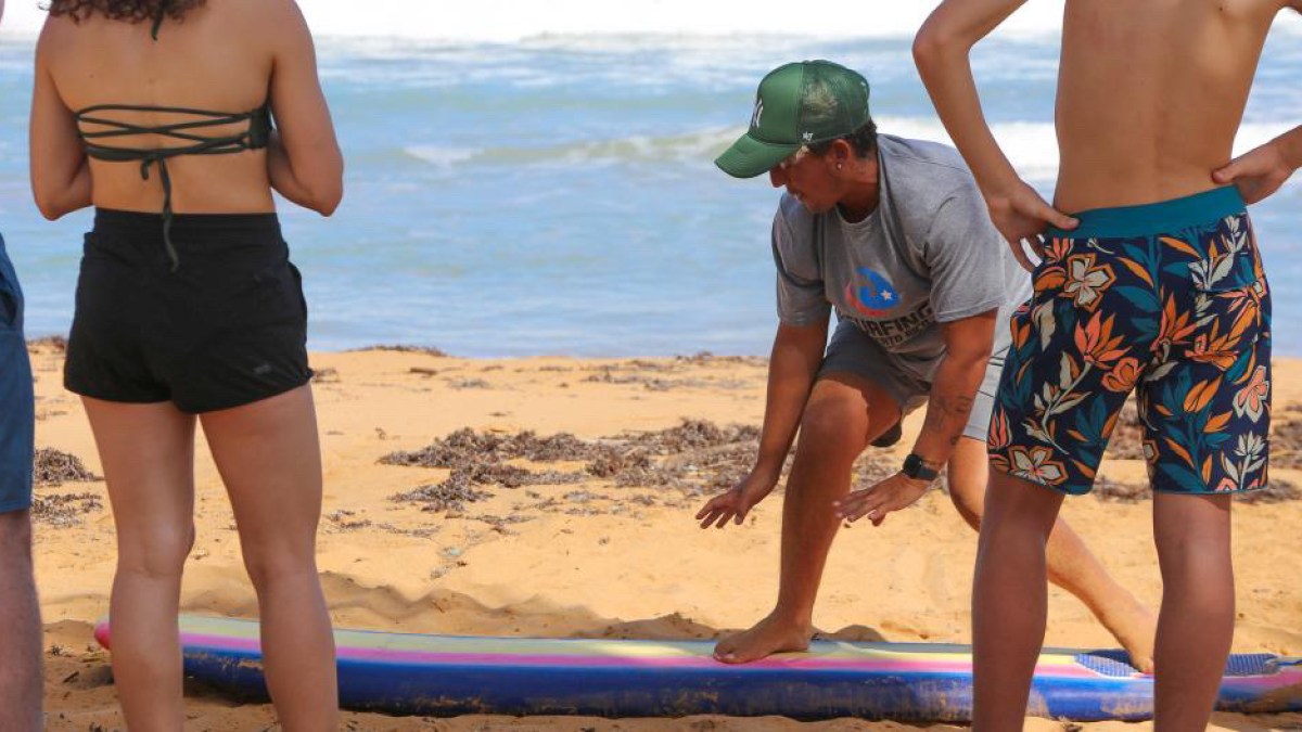 a woman standing on a beach