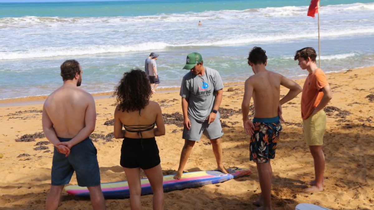 a group of people on a beach
