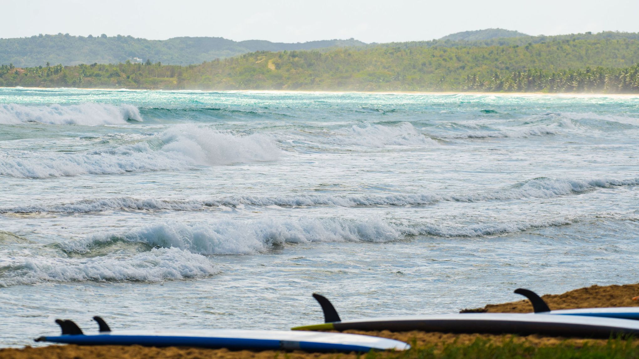 a person riding a surf board on a body of water