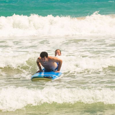 a person riding a wave on a surfboard in the ocean