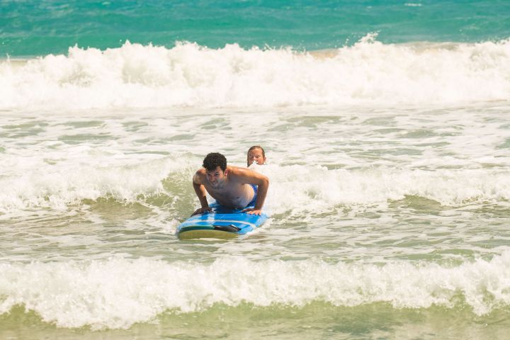 a person riding a wave on a surfboard in the ocean